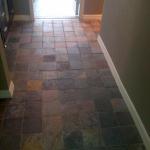 NEW 6X6 SLATE FLOOR TILE AND NEW BASEBOARD AND GROUT AFTER TILE REMOVED