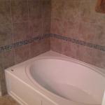 NEW SOAKER TUB WITH 12X12 AND GLASS ACCENT STRIP