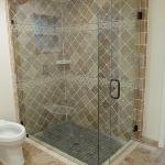 OPEN SHOWER WITH TRAVERTINE TILE