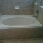 NEW OVAL SQUARE SET SOKER TUB IN EXISTING FRAMING AND CUSTOM 12X12 TILE SURROUND MATCH SHOWER COMBO